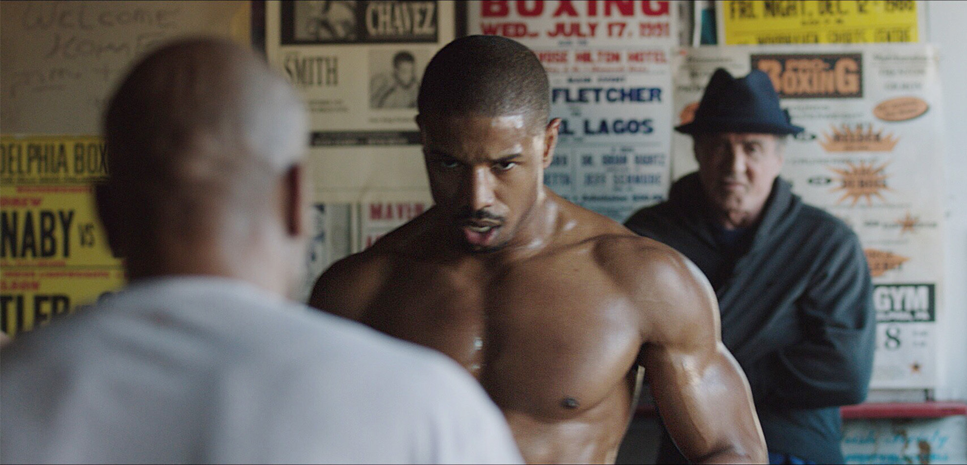 Michael B. Jordan and Sylvester Stallone as Adonis Creed and Rocky Balboa in Creed.