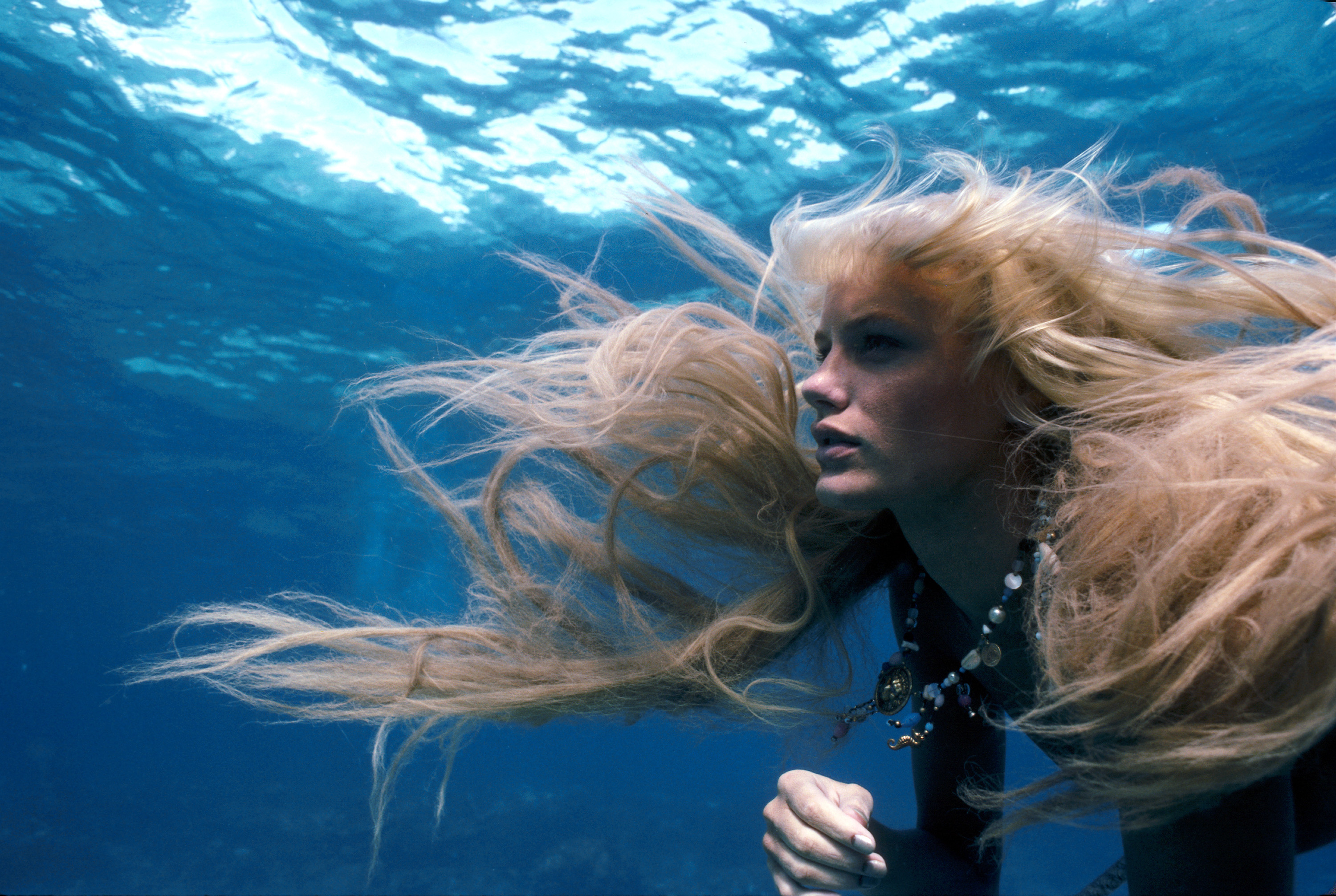 Daryl Hannah’s blonde hair floats as she swims underwater as a Mermaid in Splash.