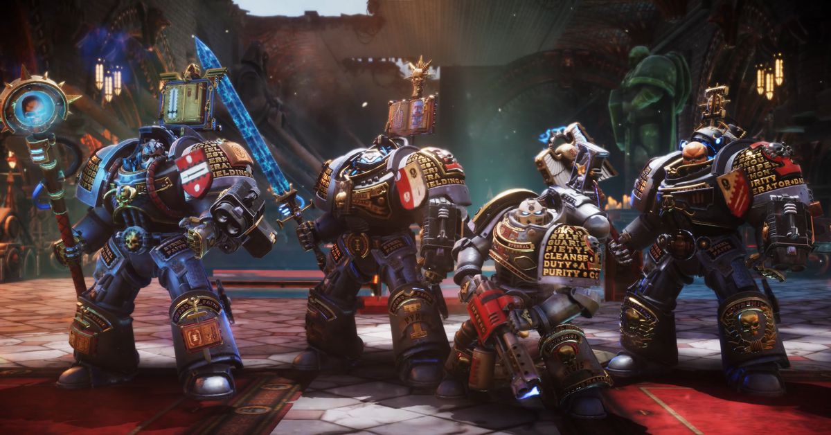 Several Space Marines line up side by side as a squad in Warhammer 40K: Chaos Gate - Daemonhunters